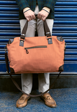 Load image into Gallery viewer, Safarnama Rust Orange Duffle Bag
